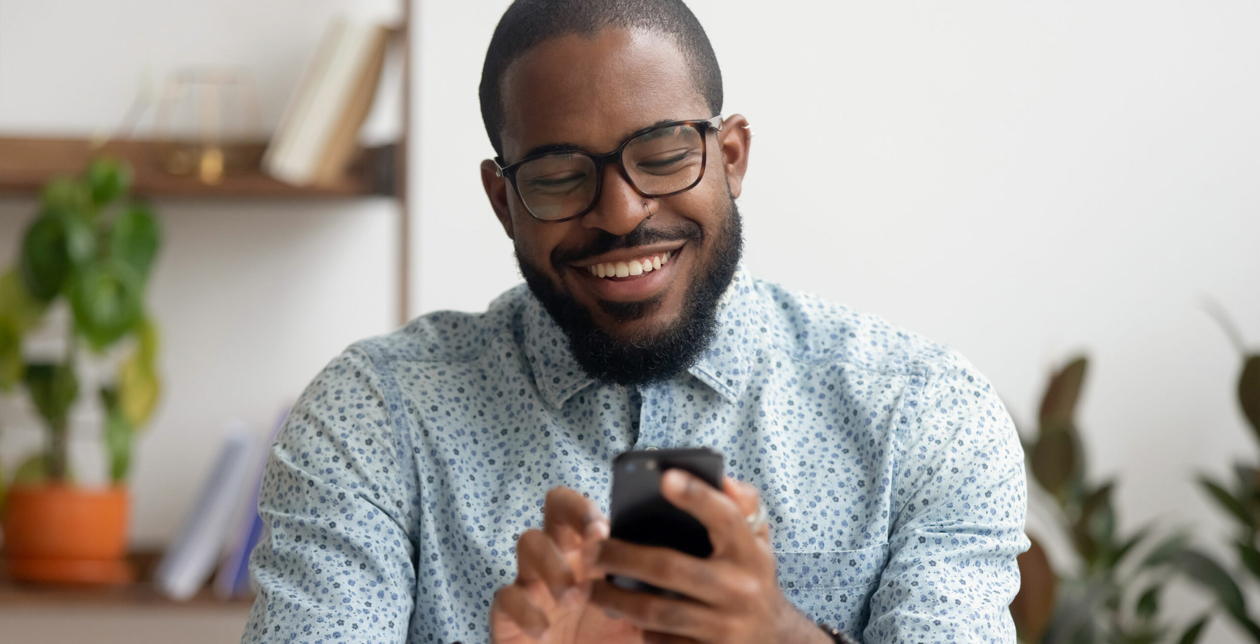 male connected consumer on cell phone